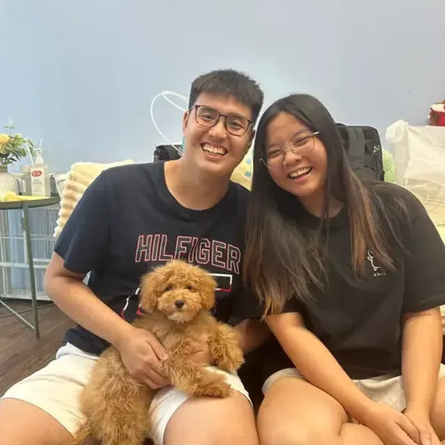 Puppy with their new family in Singapore