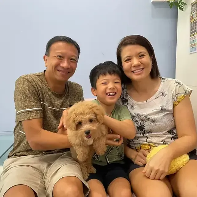 Puppy with their new family in Singapore