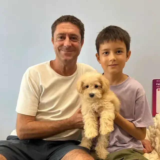 Puppy with their new family in Singapore