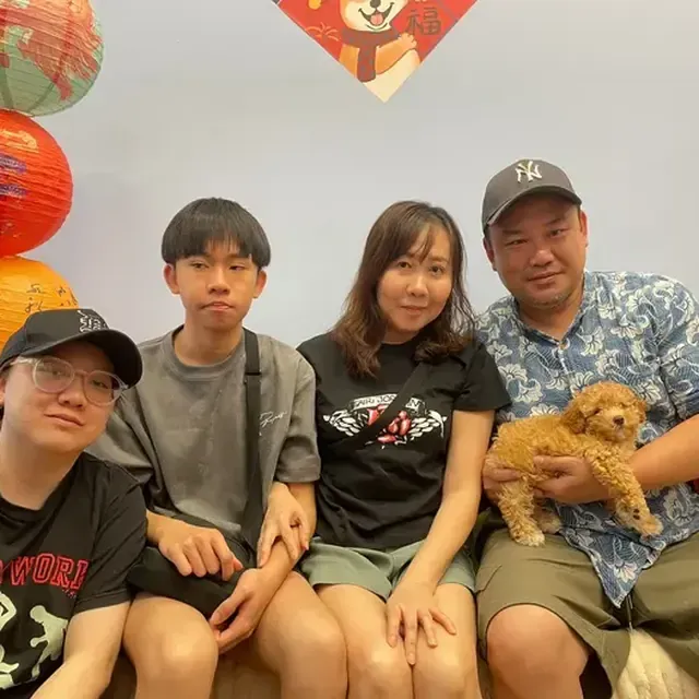 Puppy with their new family in Singapore