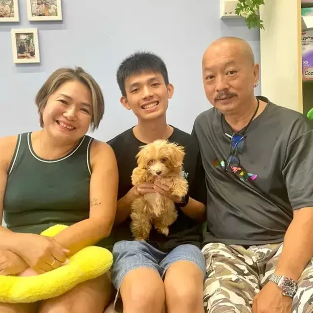 Puppy with their new family in Singapore