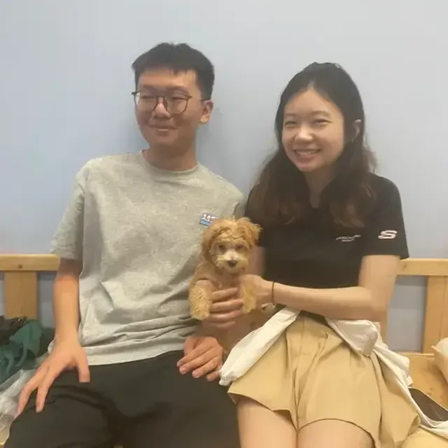 Puppy with their new family in Singapore