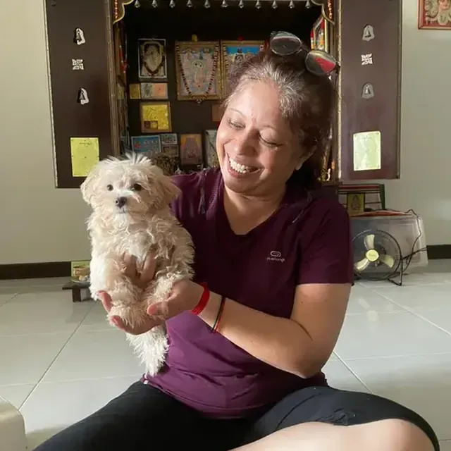 Puppy with their new family in Singapore